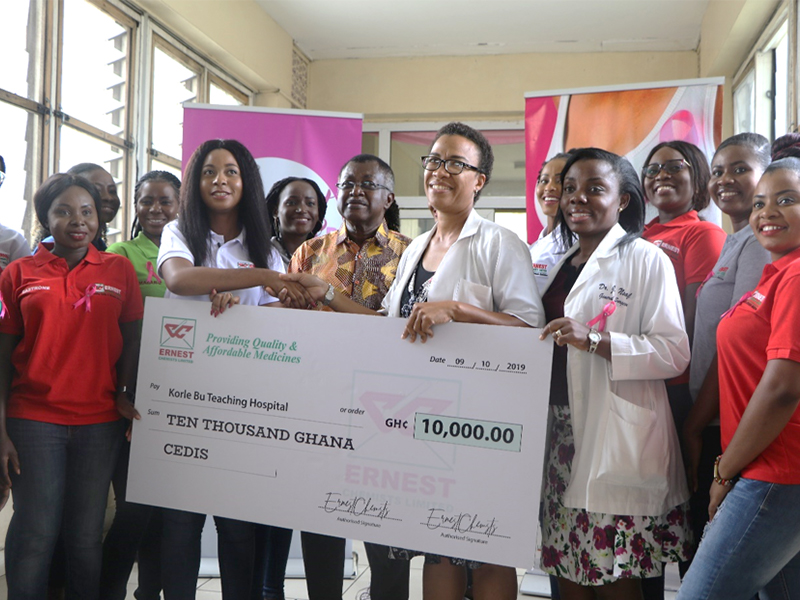The Ernest Chemists team together with GMB contestants presenting the cheque to the Korle Bu Breast Unit.
